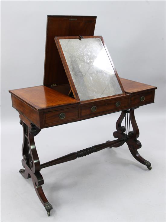 A Regency ebony strung mahogany dressing table, W.3ft 2in. D.2ft 10in. H.2ft 5in.